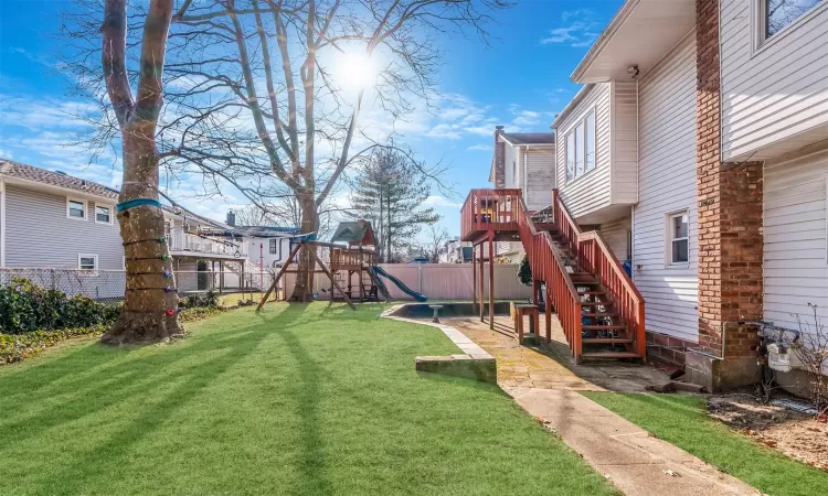 View of yard featuring a playground