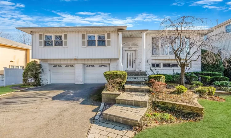 Split foyer home featuring a garage