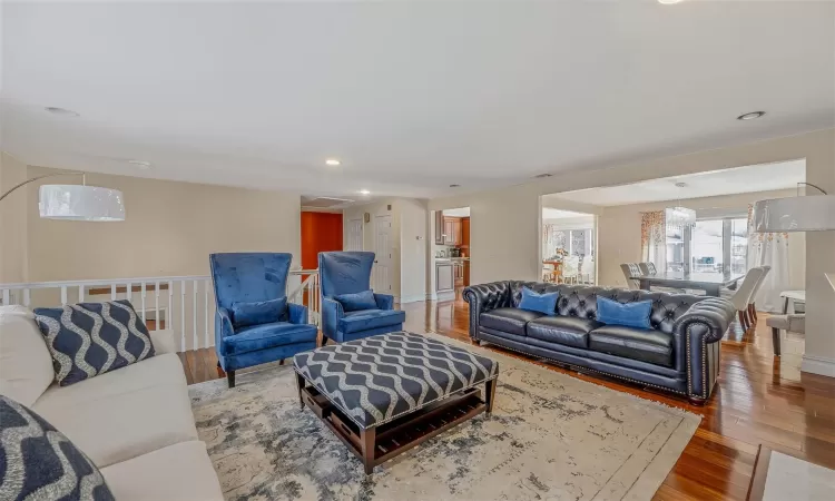 Living room with hardwood / wood-style flooring