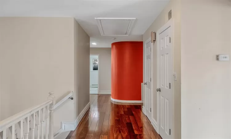 Hallway featuring wood-type flooring