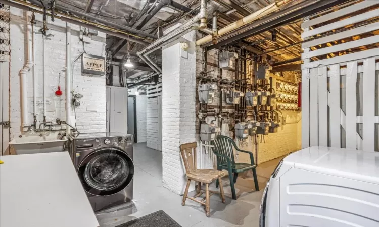 Laundry area with sink /  washer and dryer