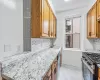 Kitchen featuring sink, decorative backsplash, and appliances with stainless steel finishes