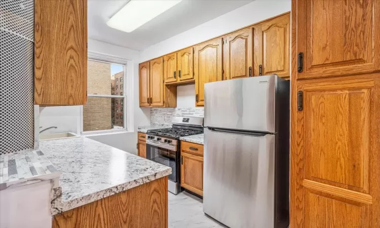 Kitchen with backsplash, new stainless steel appliances