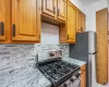 Kitchen featuring new stainless steel appliances