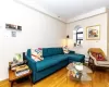 Living room with hardwood / wood-style flooring