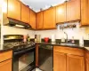 Kitchen featuring sink and black appliances