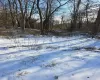 View of yard covered in snow