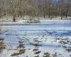 View of yard layered in snow