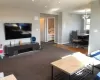 Living room featuring a notable chandelier and dark carpet