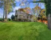 View of front property featuring a porch and a front yard