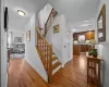 Stairway featuring wood-type flooring