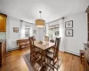 Dining space with light hardwood / wood-style flooring and a baseboard radiator