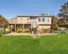 View of front of property featuring a front lawn and a deck