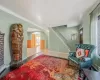 Sitting room featuring crown molding, wood-type flooring, and baseboard heating