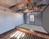 Unfurnished room with vaulted ceiling and parquet floors