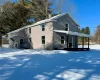 View of snow covered exterior featuring covered porch