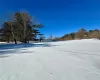 View of yard layered in snow