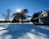 View of yard layered in snow