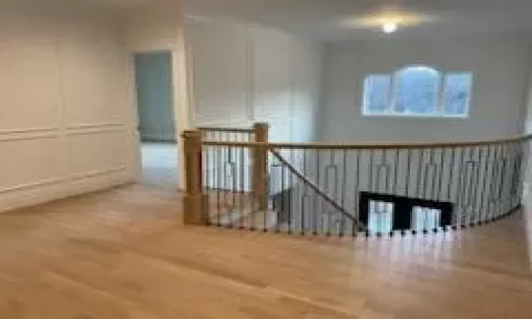 Bonus room with hardwood / wood-style floors