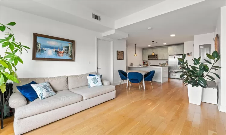 Living room with light wood-type flooring