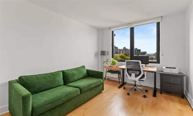 Office space with light wood-type flooring