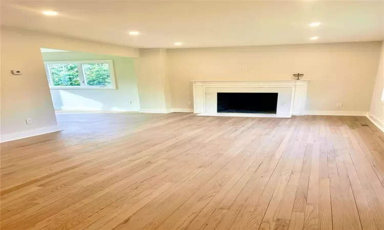 Unfurnished living room with light wood-type flooring