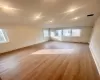 Spare room with vaulted ceiling and light hardwood / wood-style floors