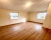 Third Bedroom featuring hardwood / wood-style flooring and lofted ceiling