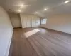 Master Bedroom with lofted ceiling, two closets, and light wood-type flooring