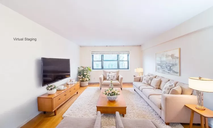 Living room with light hardwood / wood-style floors