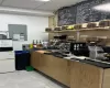 Kitchen featuring a paneled ceiling and electric panel