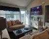 Living room with vaulted ceiling and dark hardwood / wood-style floors