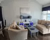 Living room with vaulted ceiling and dark hardwood / wood-style floors