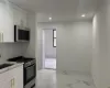 Kitchen featuring white cabinetry, stainless steel appliances, sink, and decorative backsplash