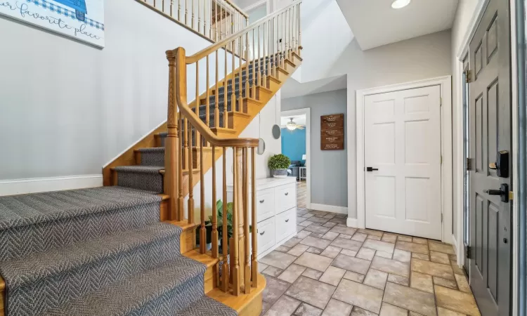 Stairs featuring ceiling fan