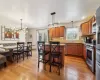 Kitchen featuring pendant lighting, stainless steel appliances, a breakfast bar, and a kitchen island