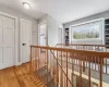 Hallway with light hardwood / wood-style flooring