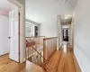 Corridor with light hardwood / wood-style floors