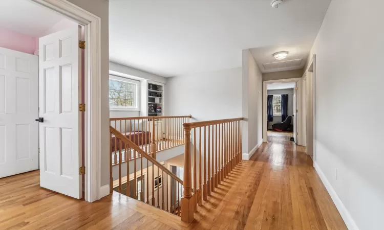 Corridor with light hardwood / wood-style floors