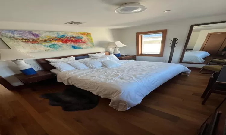 Bedroom featuring dark hardwood / wood-style flooring