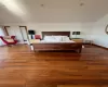 Bedroom featuring lofted ceiling and wood-type flooring