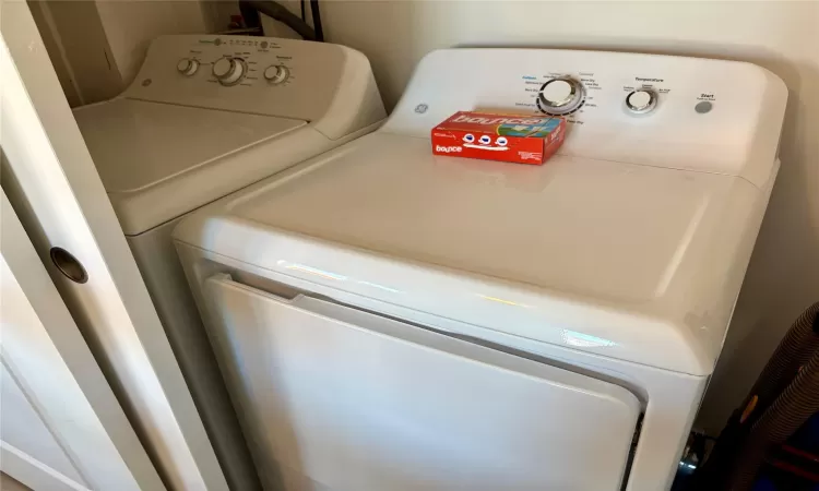 Laundry area with washing machine and clothes dryer