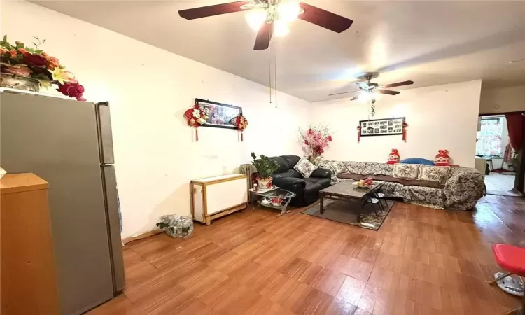 Living room with light hardwood / wood-style flooring