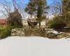 Snow covered property featuring a deck