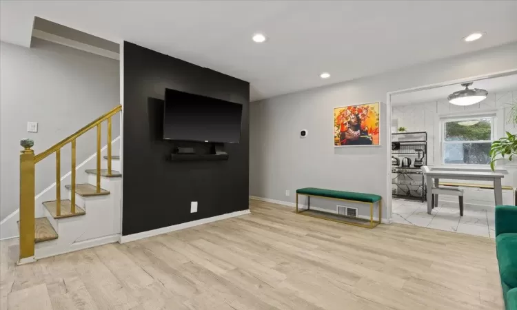 Living room with light wood-type flooring