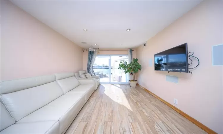 Unfurnished living room with light hardwood / wood-style flooring