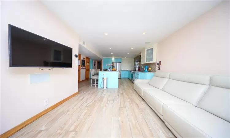 Unfurnished living room with light wood-type flooring