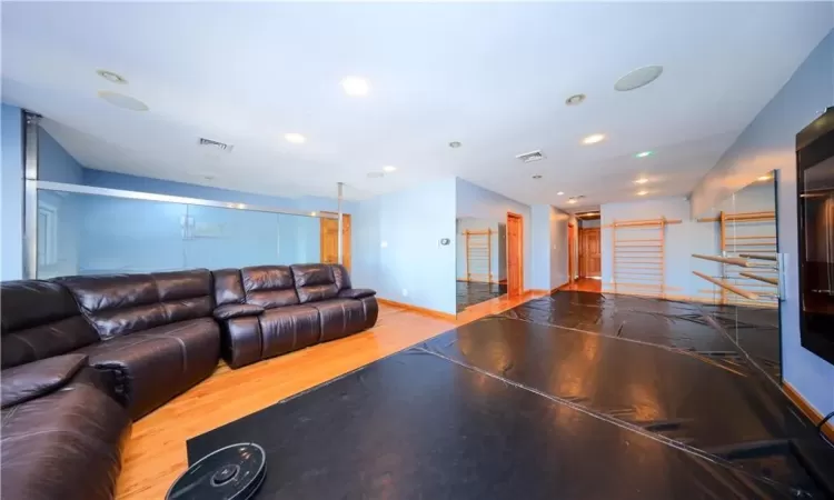 Recreation room featuring hardwood / wood-style flooring