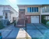 View of front facade featuring a garage