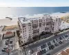 Bird's eye view featuring a water view and a view of the beach